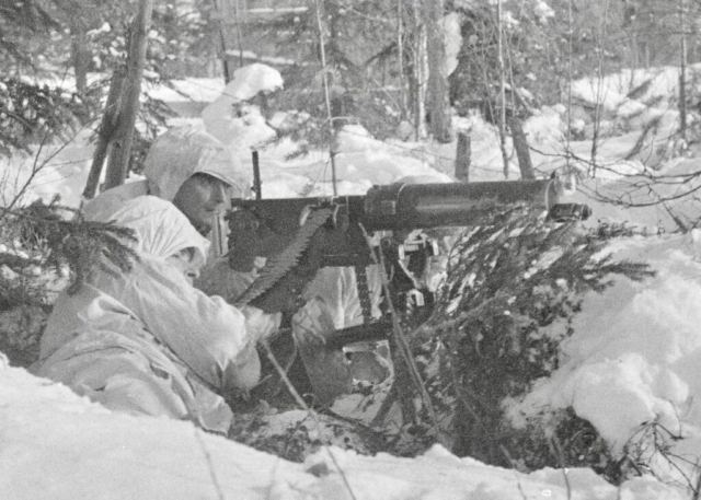 Finnish soldiers man a camoflauged Russian Imperial army field gun dating from WWI. Photo credit SA-Kuva