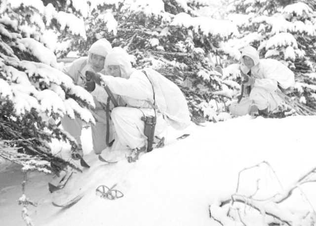Finnish soldiers on patrol near Lake Kemijärvi, January 1940. Note skis and camoflauge, which would go on to inspire global considerations of cold-weather warfar; in the US, they helped spark the formation of the 10th Mountain Division. Russians would not develop a similar ability to patrol on skis until near the end of the war. Photo credit SA-Kuva