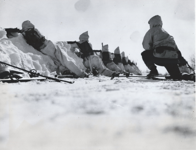 Troops of the 28th Infantry advance on skis over the snow-covered terrain of Pine Camp during the battle that served as the climax of the winter maneuvers. Courtesy Doug Schmidt/National Association of the 10th Mountain Division, Inc.