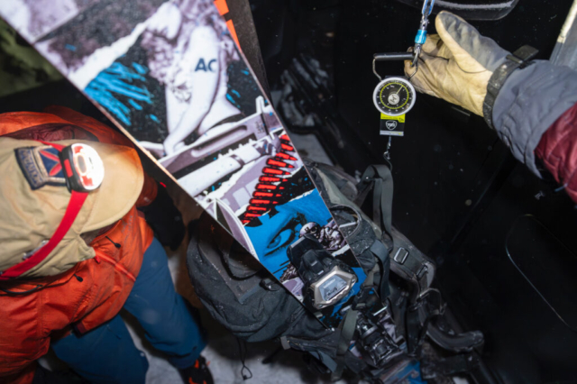 A participant in the Mt. Glory leg weighs his pack. Photo: Chris Anderson