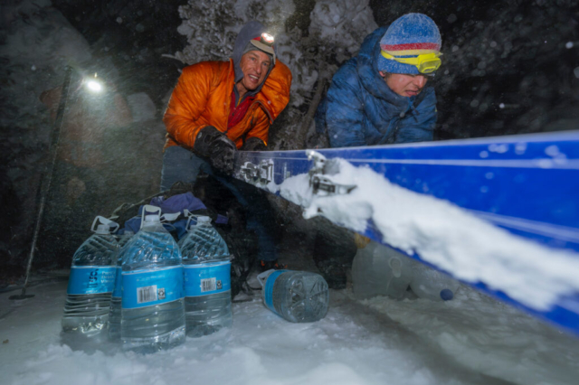 Beckwith and fellow participant Wyatt Sullivan dump weight in the form of water atop Mt. Glory. Photo: Chris Anderson